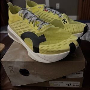 On Running Cloudboom Strike in Yellow and Black